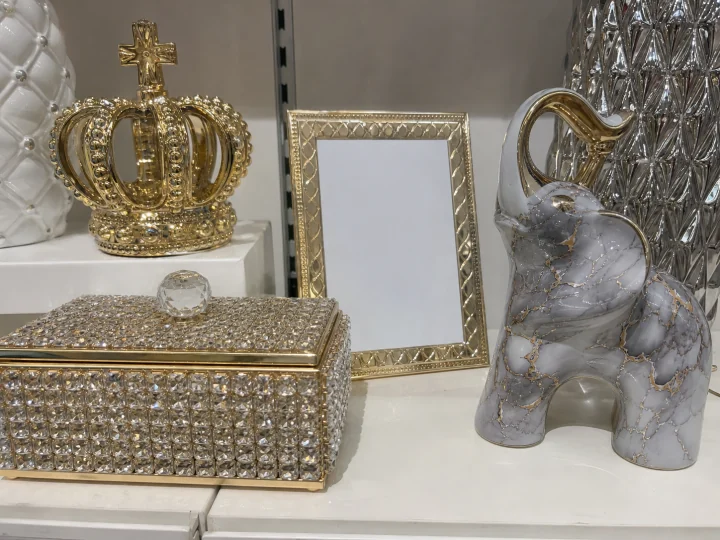 Rhinestone box, ornate gold crown ornament, and glossy faux-marble figurine