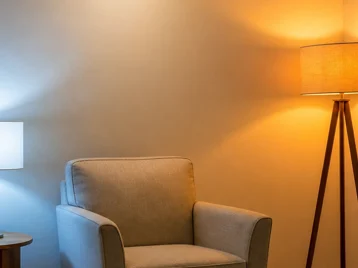 Apartment corner with one icy blue-white lamp and one overly orange floor lamp