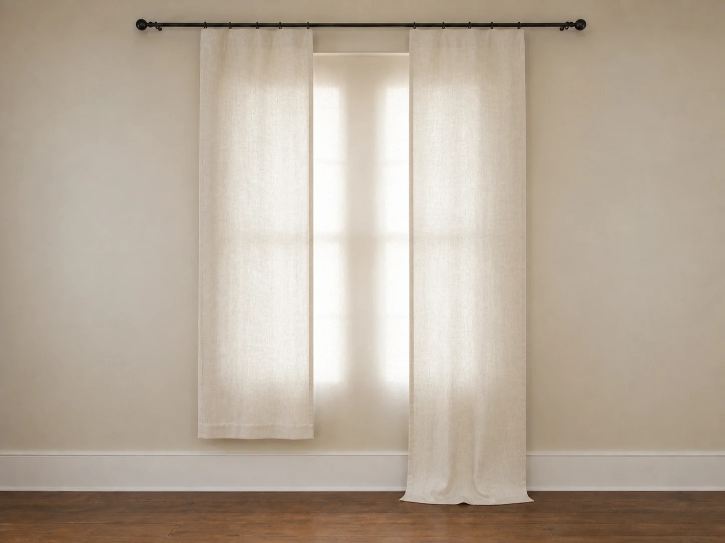 Two flat narrow curtain panels with a center gap and mismatched short and puddled hems