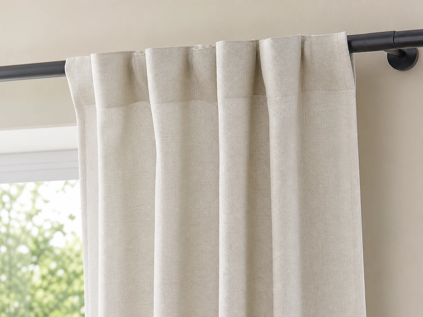 Close view of matte linen-look curtain with hidden back tabs and even soft folds